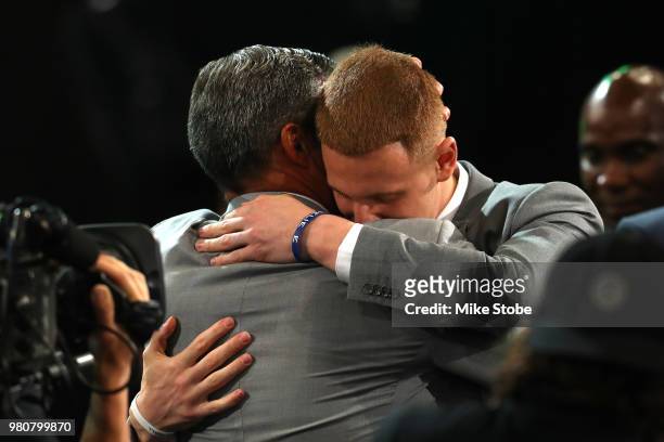 Donte DiVincenzo reacts with head coach Jay Wright of the Villanova Wildcats after being drafted 17th overall by the Milwaukee Bucks during the 2018...