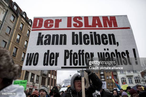 Participant hold a banner as he take part in an anti-refugee demonstration orginized by the group 'Zukunft Heimat', in Cottbus, Germany, 17 March...