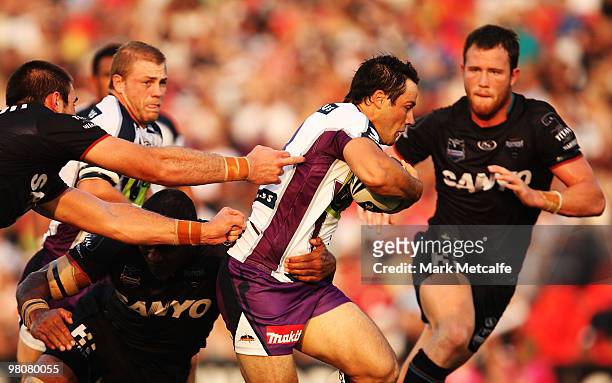 Cooper Cronk of the Storm breaks through the Panthers defence during the round three NRL match between the Penrith Panthers and the Melbourne Storm...
