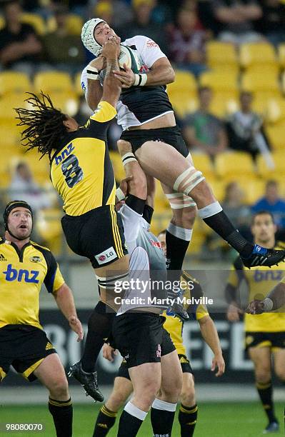 Rodney So'oialo of the Hurricanes jumps for the ball with Steven Sykes of the Sharks during the round seven Super 14 match between the Hurricanes and...
