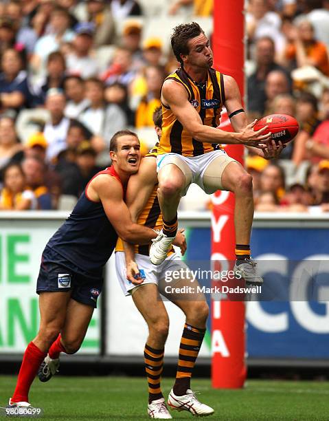 Liam Shiels of the Hawks flies for a mark during the round one AFL match between the Melbourne Demons and the Hawthorn Hawks at Melbourne Cricket...