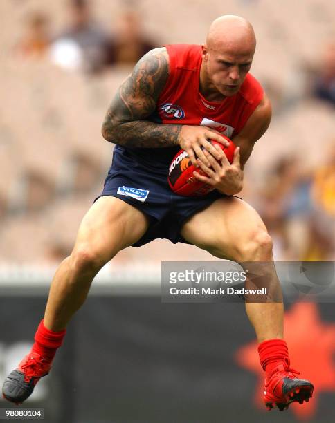 Nathan Jones of the Demons marks during the round one AFL match between the Melbourne Demons and the Hawthorn Hawks at Melbourne Cricket Ground on...