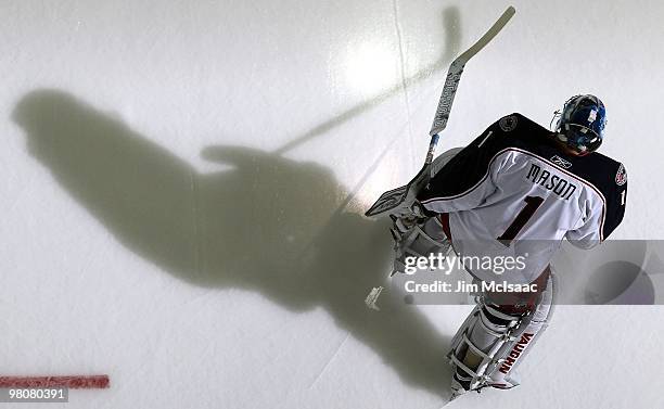 Steve Mason of the Columbus Blue Jackets warms up before playing against the New Jersey Devils at the Prudential Center on March 23, 2010 in Newark,...