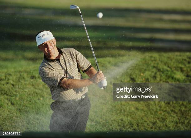 Mark O'Meara of the United States hits out of the sand bunker during the Franklin Funds Shark Shootout golf tournament on 21 November 1993 at the...