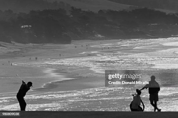 Jay Haas of the United States silhouetted against the oceanside backdrop as he plays from the ninth fairway during the AT&T Pebble Beach Pro-Am golf...