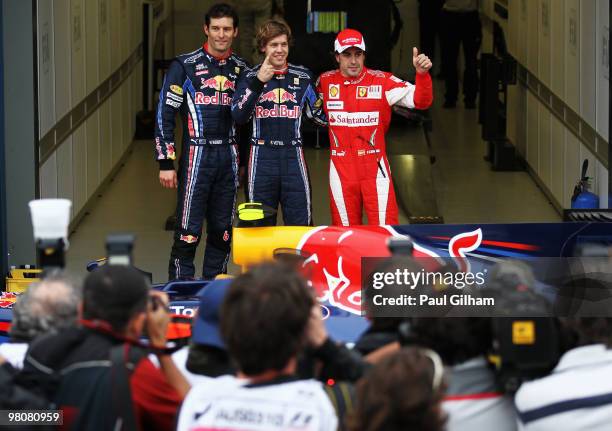 Pole sitter Sebastian Vettel of Germany and Red Bull Racing celebrates in parc ferme alongside second placed Mark Webber of Australia and Red Bull...