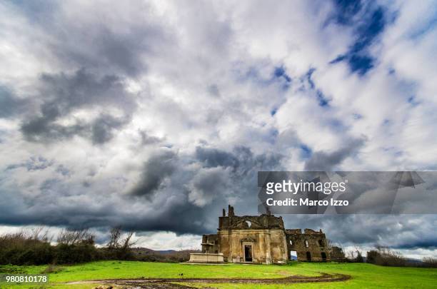 clouds over old ruins, canale monterano, rome, latium, italy - canale stock-fotos und bilder
