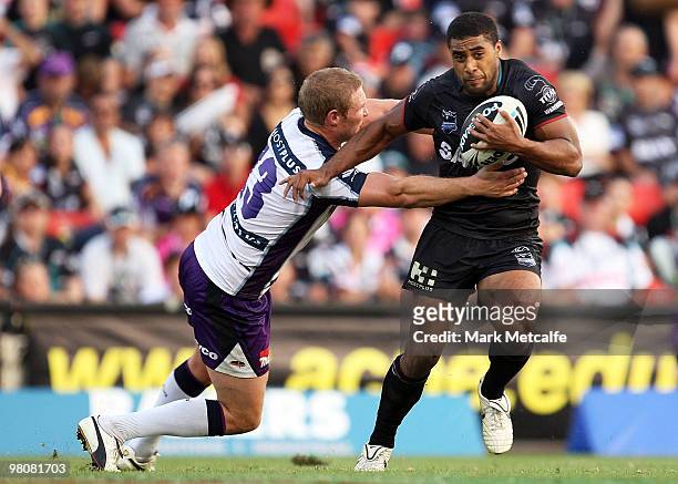 Michael Jennings of the Panthers is tackled by Todd Lawrie of the Storm during the round three NRL match between the Penrith Panthers and the...