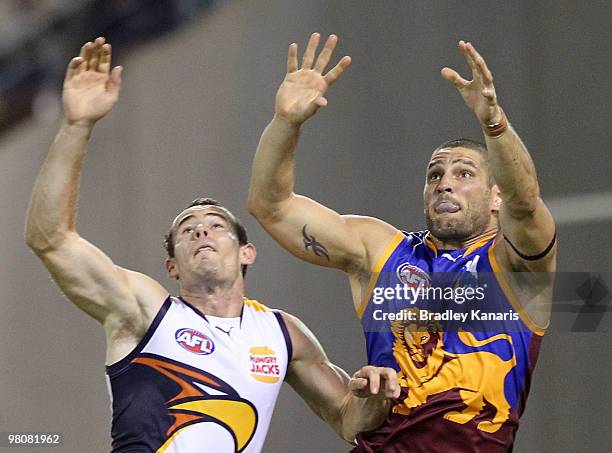 Brendan Fevola of the Lions and Brad Ebert of the Eagles compete during the round one AFL match between the Brisbane Lions and the West Coast Eagles...