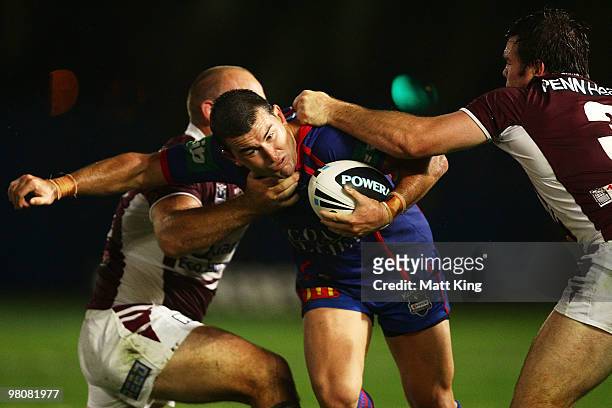Shannon McDonnell of the Knights takes on the defence during the round three NRL match between the Manly Warringah Sea Eagles and the Newcastle...