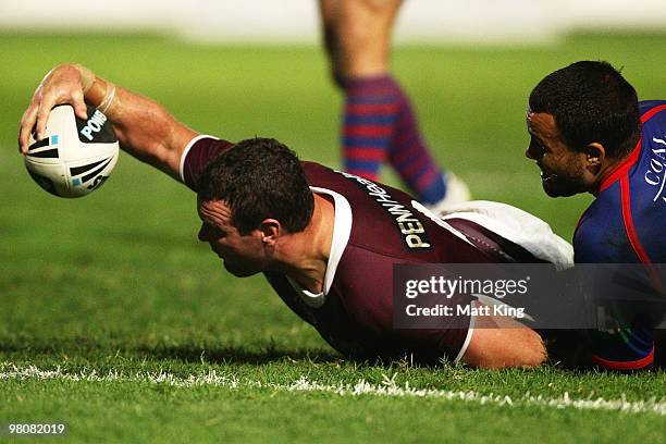 Jason King of the Sea Eagles reaches over the line to score a try during the round three NRL match between the Manly Warringah Sea Eagles and the...