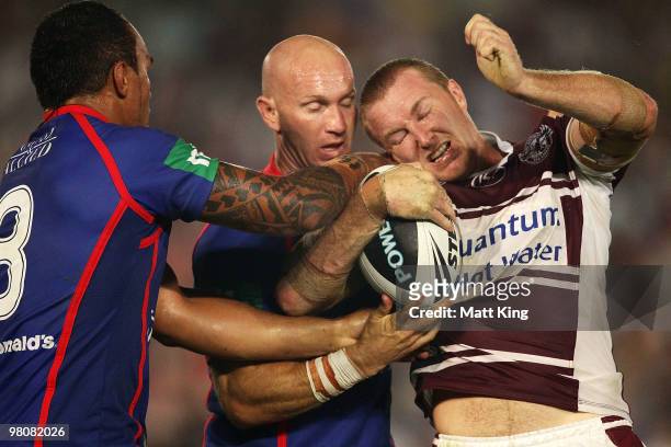 Shane Rodney of the Sea Eagles wrestles in a tackle during the round three NRL match between the Manly Warringah Sea Eagles and the Newcastle Knights...