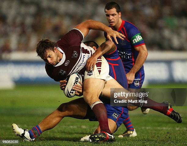 Josh Perry of the Sea Eagles takes on the defence during the round three NRL match between the Manly Warringah Sea Eagles and the Newcastle Knights...