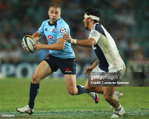 Drew Mitchell of the Waratahs runs the ball during the round seven Super 14 match between the Waratahs and the Blues at Sydney Football Stadium on...