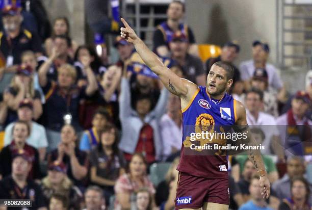 Brendan Fevola of the Lions celebrates after scoring a goal during the round one AFL match between the Brisbane Lions and the West Coast Eagles at...