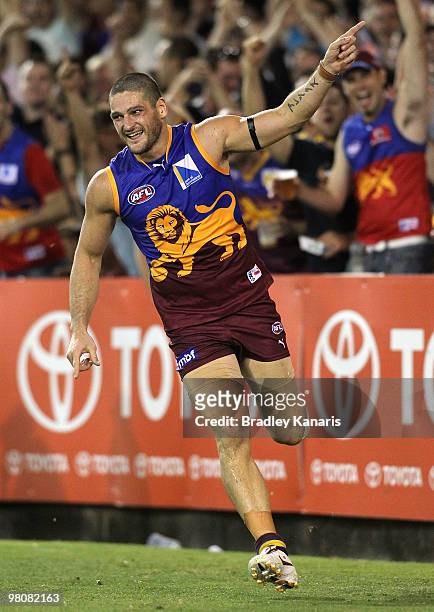 Brendan Fevola of the Lions celebrates after scoring a goal during the round one AFL match between the Brisbane Lions and the West Coast Eagles at...