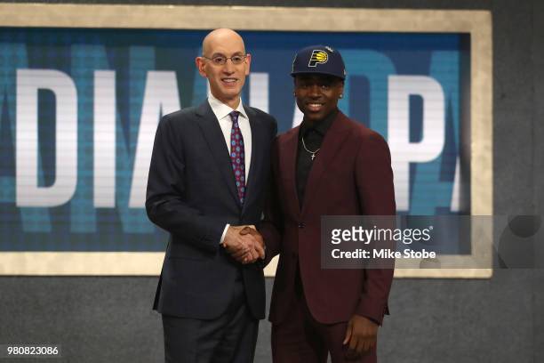 Aaron Holiday poses with NBA Commissioner Adam Silver after being drafted 23rd overall by the Indiana Pacers during the 2018 NBA Draft at the...