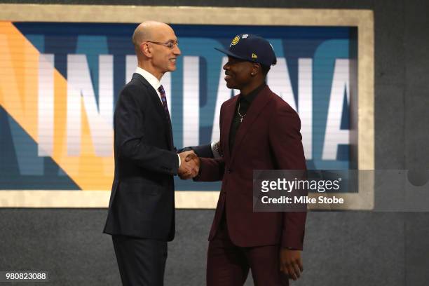 Aaron Holiday poses with NBA Commissioner Adam Silver after being drafted 23rd overall by the Indiana Pacers during the 2018 NBA Draft at the...