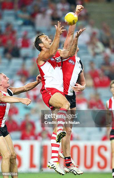 Daniel Bradshaw of the Swans contests possession during the round one AFL match between the Sydney Swans and the St Kilda Saints at ANZ Stadium on...