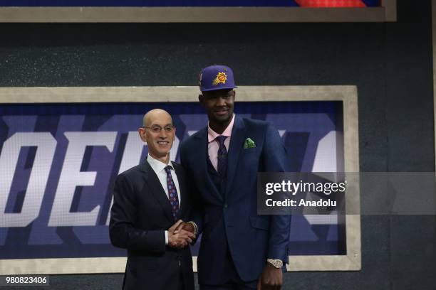 Deandre Ayton poses with NBA Commissioner Adam Silver after being drafted first overall by the Phoenix Suns during the 2018 NBA Draft at the Barclays...