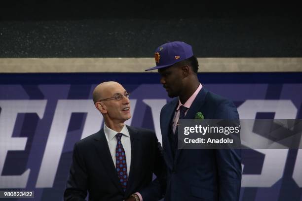 Deandre Ayton poses with NBA Commissioner Adam Silver after being drafted first overall by the Phoenix Suns during the 2018 NBA Draft at the Barclays...