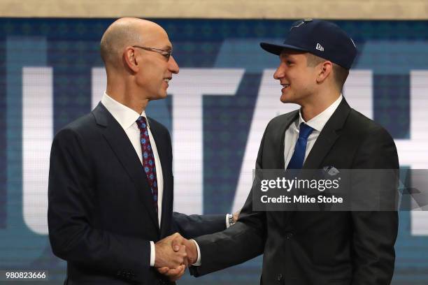 Grayson Allen poses with NBA Commissioner Adam Silver after being drafted 21st overall by the Utah Jazz during the 2018 NBA Draft at the Barclays...