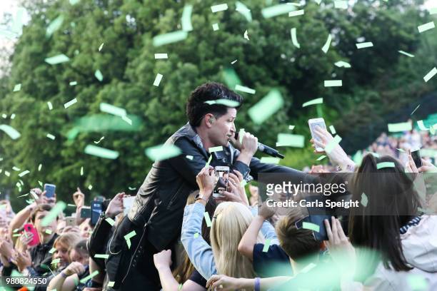 The Script's Danny O'Donoghue performs with fans in the crowd at Scarborough Open Air Theatre on June 21, 2018 in Scarborough, England.