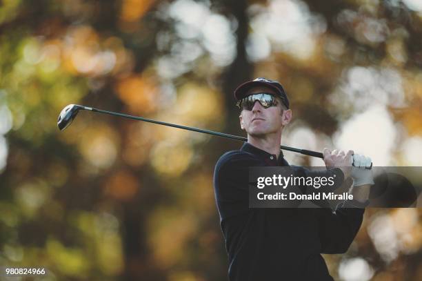 David Duval of the United States Team drives off the tee in front of the watching spectators during the 4th Presidents Cup golf tournament on 22...