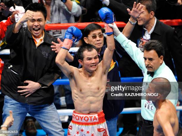 Thailand's challenger Pongsaklek Wonjogkam celebrates his victory over Japanese champion Koki Kameda following their WBC flyweight title match at...