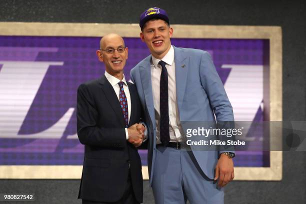 Moritz Wagner poses with NBA Commissioner Adam Silver after being drafted 25th overall by the Los Angeles Lakers during the 2018 NBA Draft at the...