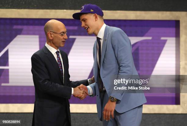 Moritz Wagner poses with NBA Commissioner Adam Silver after being drafted 25th overall by the Los Angeles Lakers during the 2018 NBA Draft at the...