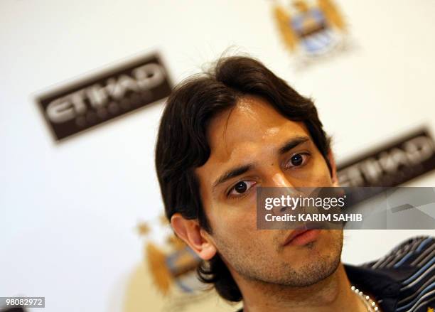 Manchester City's new signing Paraguay striker Roque Santa Cruz attends a press conference at the Emirates Palace hotel in Abu Dhabi on July 16,...