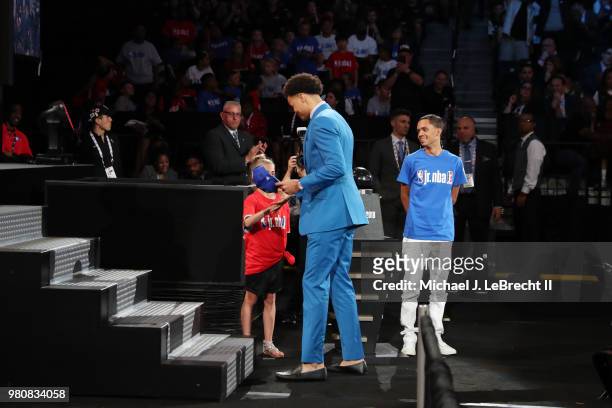 Jerome Robinson puts on the LA Clippers 2018 Draft hat after being selected thirteenth by the LA Clippers on June 21, 2018 at Barclays Center during...