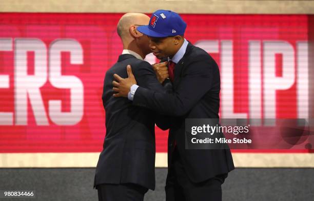 Miles Bridges poses with NBA Commissioner Adam Silver after being drafted 12th overall by the Los Angeles Clippers during the 2018 NBA Draft at the...