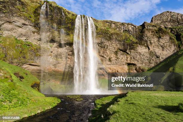 rainbow in waterfall, iceland - rainbow waterfall stock pictures, royalty-free photos & images