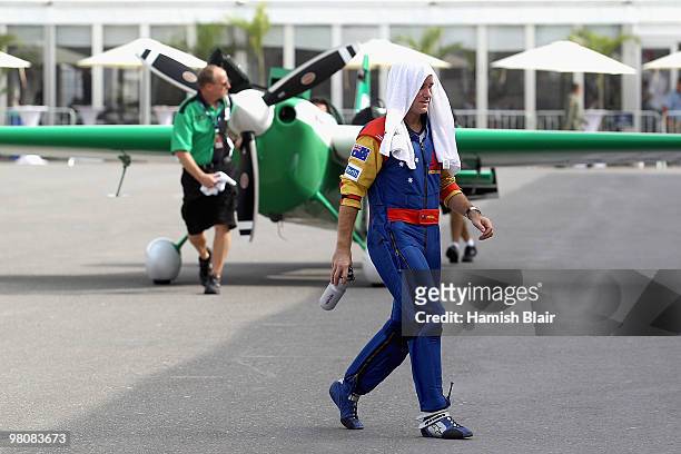 Matt Hall of Australia crosses the pit lane to his hangar during the Red Bull Air Race day on March 27, 2010 in Abu Dhabi, United Arab Emirates.