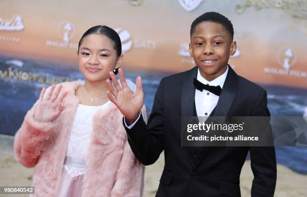 March 2018, Germany, Berlin: Actors Leighanne Esperanzate and Solomon Gordon arriving at the premiere of the film 'Jim Knopf und Lukas der...