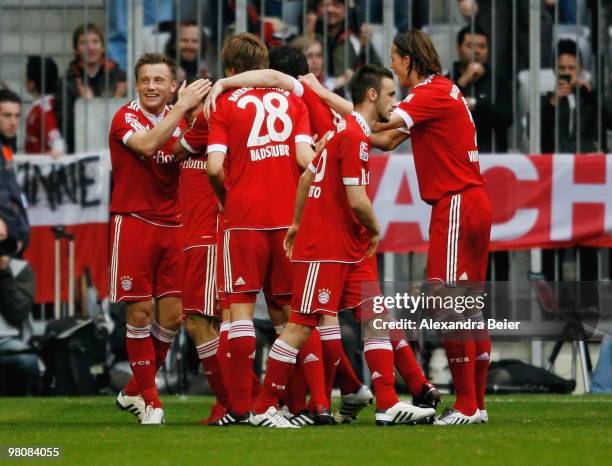 Ivica Olic of Bayern Muenchen celebrates after scoring his team's first goal with team mates during the Bundesliga match between FC Bayern Muenchen...