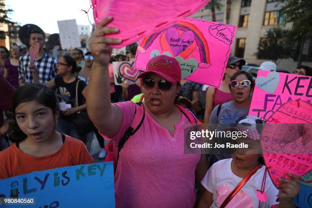 Protesters walk though the streets as they protest against the Trump administration's immigration policies on June 21, 2018 in El Paso, Texas. Before...