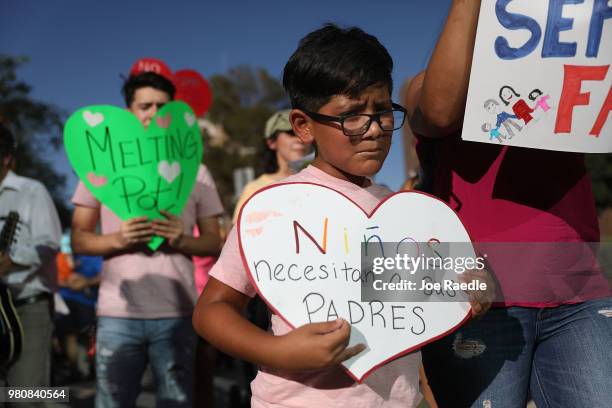 Protesters walk though the streets as they protest against the Trump administration's immigration policies on June 21, 2018 in El Paso, Texas. Before...