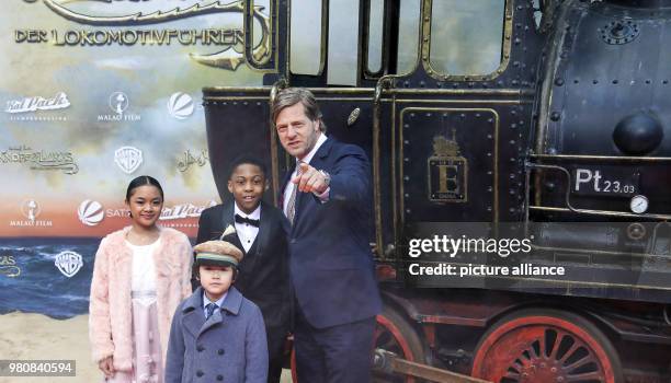 March 2018, Germany, Berlin: Actors Leighanne Esperanzate , Eden Gough, Solomon Gordon and Henning Baum arriving at the premiere of the film 'Jim...