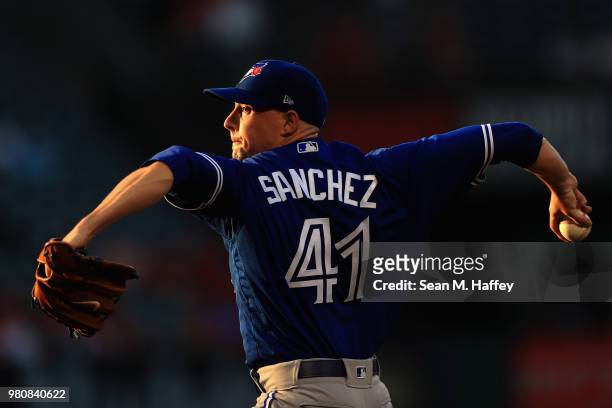 Aaron Sanchez of the Toronto Blue Jays pitches during the first inning of a game against the Los Angeles Angels of Anaheim at Angel Stadium on June...