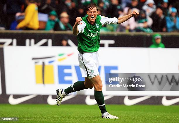 Tim Borowski of Bremen celebrates after scoring his team's third goal during the Bundesliga match between Werder Bremen and 1. FC Nuernberg at the...