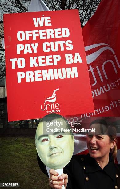 British Airways cabin crew demonstrate at Heathrow airport with a face mask of British Airways Chief Executive Willie Walsh on March 27, 2010 in...