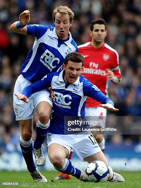 Lee Bowyer and Barry Ferguson of Birmingham City get tangled up during the Barclays Premier League match between Birmingham City and Arsenal at St....