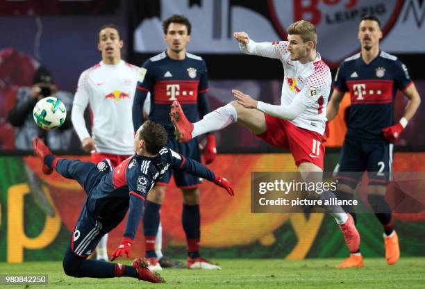 March 2018, Germany, Leipzig: Soccer, Bundesliga, 1. RB Leipzig vs Bayern Munich at the Red Bull Arena. Leipzig's Timo Werner and Munich's Sebastian...