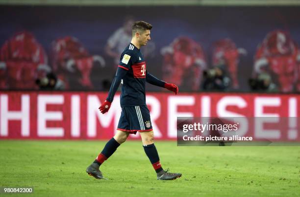 March 2018, Germany, Leipzig: Soccer, Bundesliga, 1. RB Leipzig vs Bayern Munich at the Red Bull Arena. Munich's Robert Lewandowski walking past a...