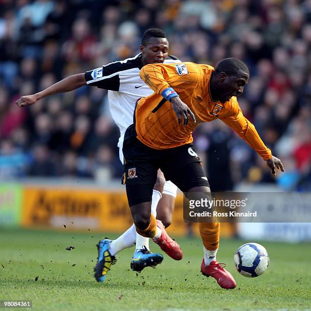 Jozy Altidore of Hull is fouled by Kagisho Dikgacoi of Fulham during the Barclays Premier League match between Hull City and Fulham at the KC Stadium...