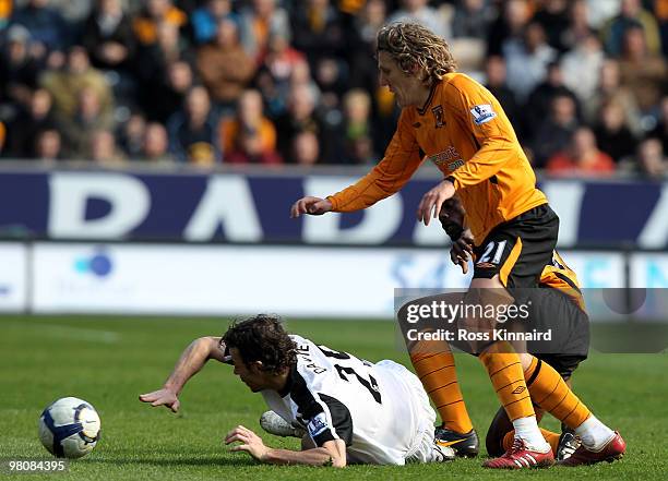 Jimmy Bullard of Hull is challenged by Simon Davies of Fulham during the Barclays Premier League match between Hull City and Fulham at the KC Stadium...