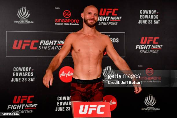Donald Cerrone poses on the scale during the UFC Fight Night weigh-in at the Mandarin Oriental on June 22, 2018 in Singapore.